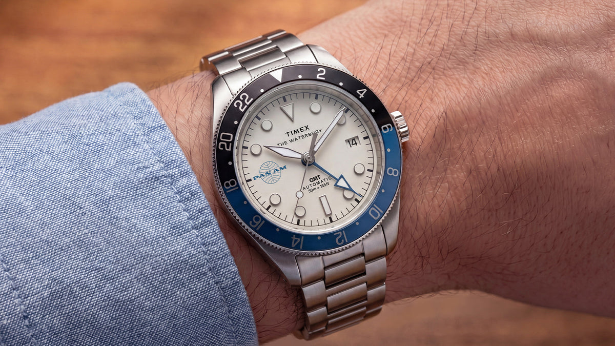 TW2Y94300 Pan Am x Timex Waterbury Automatic GMT watch with a stainless-steel bracelet worn on the wrist.