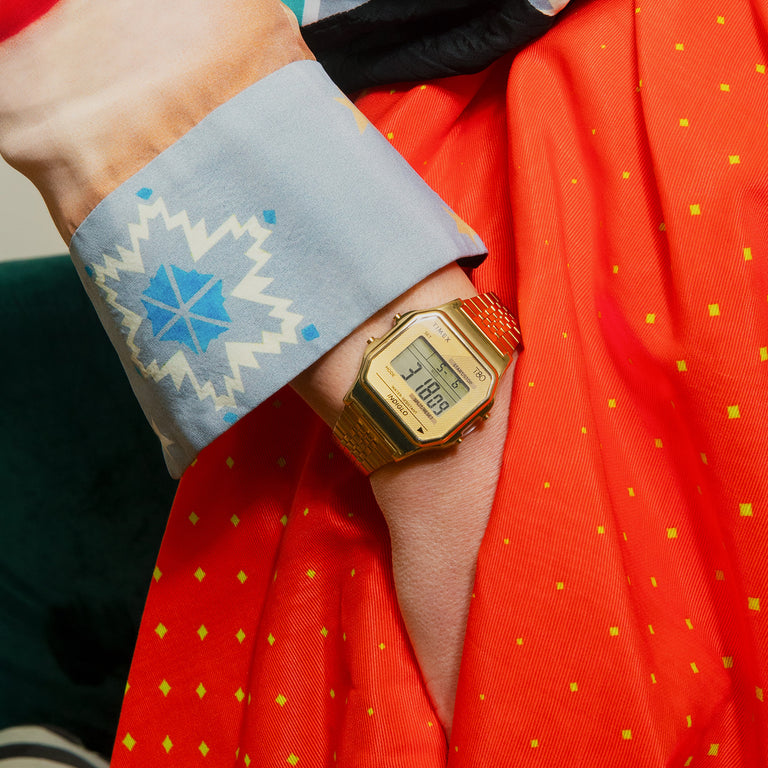 Timex T80 in gold featured on a woman's wrist