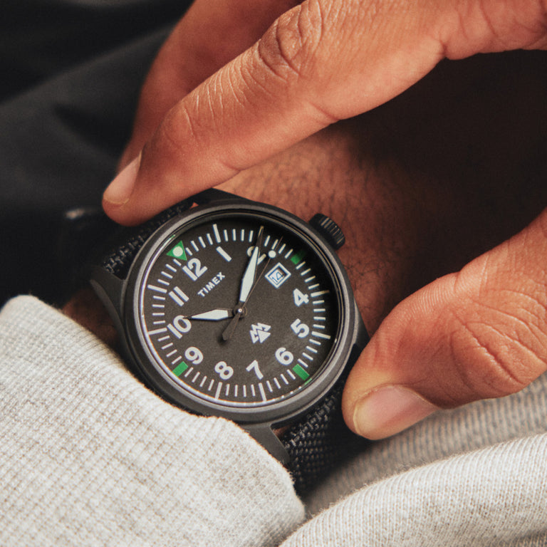 Expedition North Traprock in Black on a mans wrist.  Our Expedition North Traprock is made with sustainable materials. 