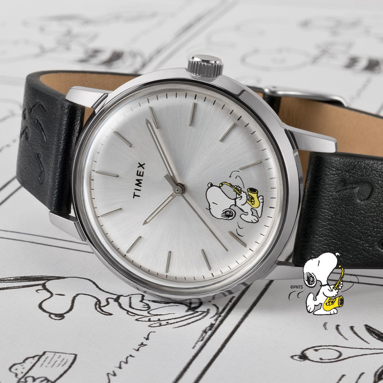 Timex Marlin Peanuts watch with silver dial featuring Snoopy illustration and black leather strap