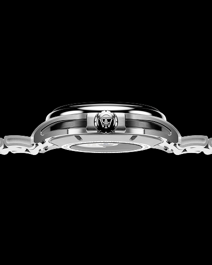 Side profile of the Timex Atelier GMT Automatic watch showing its slim stainless-steel case, engraved crown, and integrated bracelet design.