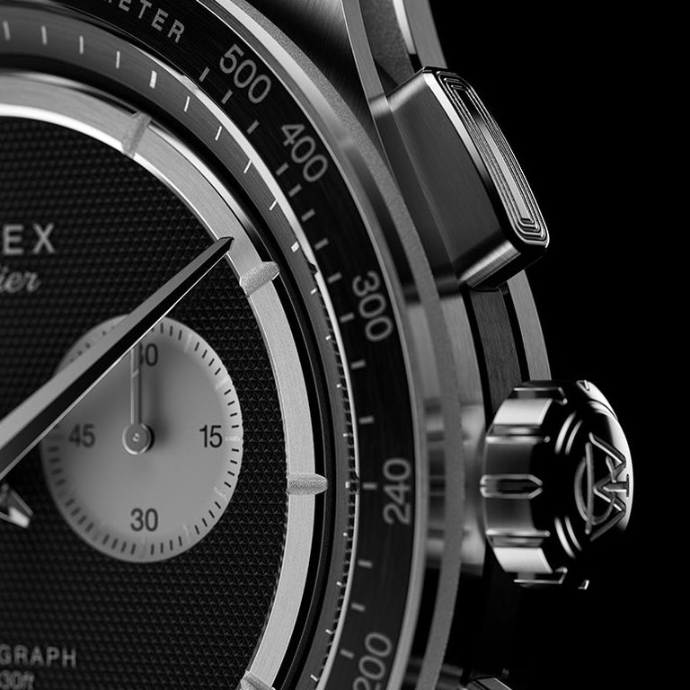 Close-up of Timex Atelier Chronograph Quartz M1a showing tachymeter bezel, crown with logo, and chronograph pusher