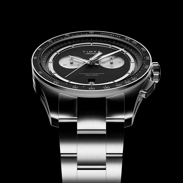 Low-angle view of Timex Atelier Chronograph Quartz M1a highlighting textured dial and integrated metal bracelet