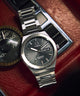 TW2Y25000 Q Timex® Continental Day and Date 39mm Stainless Steel Bracelet Watch Campaign Key Silhouettes (Beauty shots) Image