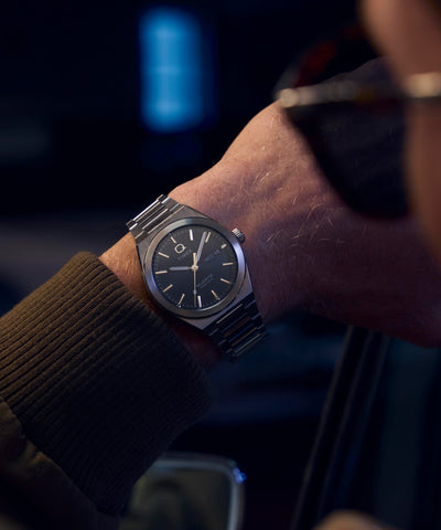 TW2Y25000 Q Timex® Continental Day and Date 39mm Stainless Steel Bracelet Watch Alt Wrist Shot 1 Image