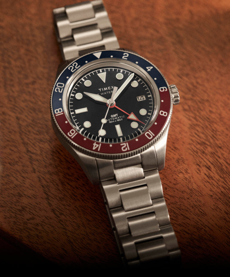 TW2Y60600 Waterbury Heritage Automatic GMT 41.5mm Stainless Steel Bracelet Watch Campaign Key Silhouettes (Beauty shots) Image