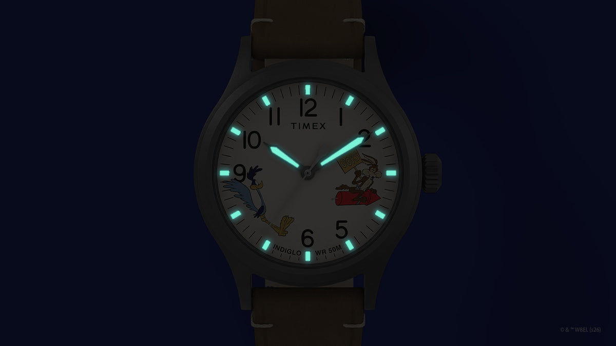 TW2Y99400 Road Runner & Wile E. Coyote x Timex Expedition® Scout watch with turquoise hands and hour markers glowing around the character dial.