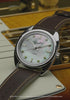 Fender x Timex watch transitions from an angled view on an electric guitar to centered front views with guitars and amplifiers in the background.