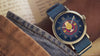 Video showcasing Harry Potter x Timex Weekender Butterbeer watch highlighting Butterbeer dial artwork, gold-tone case, and blue fabric strap.