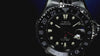 Scuba diver exploring a vibrant coral reef while wearing the Timex Deepwater Meridian 200 Automatic GMT, showcasing its underwater-ready design and 200-meter water resistance.