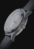 Timex Marlin® Jet Titanium Automatic GMT, highlighting its lightweight titanium case, automatic GMT movement, exhibition caseback, cream dial, and black leather strap from multiple angles.