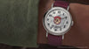 Video showcasing Harry Potter x Timex Weekender Platform 9¾ watch highlighting emblem dial, train artwork, and red leather strap.