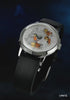 A promotional video showcasing the Timex x Peanuts® Marlin® Automatic Space watch. The watch features a silver dial illustrated with Snoopy, Charlie Brown, Lucy, Franklin, and Peppermint Patty in orange space suits floating inside a spacecraft. The animation transitions between close-up shots of the dial, the automatic movement visible through the transparent caseback decorated with Peanuts characters, and lifestyle shots of the watch being worn.